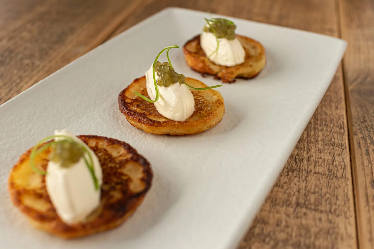 Potato blinis with sour cream and Algae Pearls - Lofoten Seaweed
